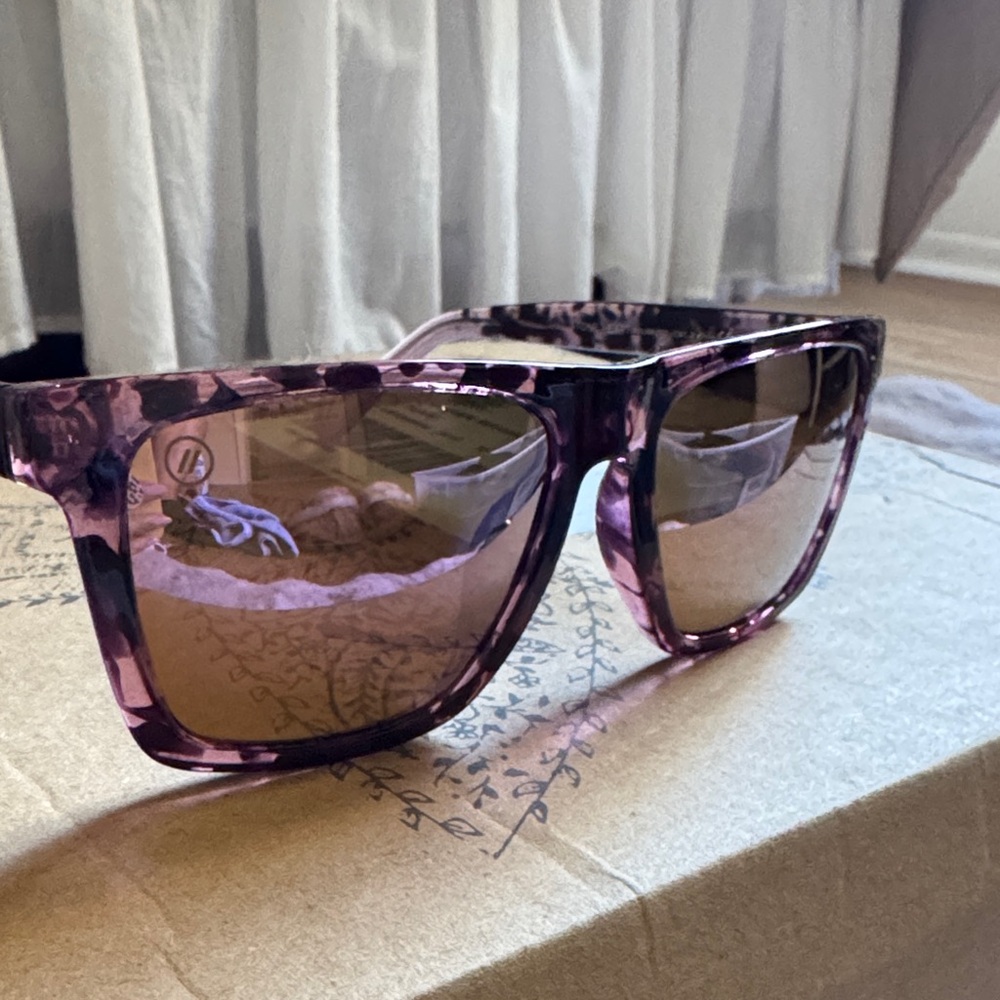 Blenders Pink Tortoiseshell Sunglasses with pink reflective lenses.